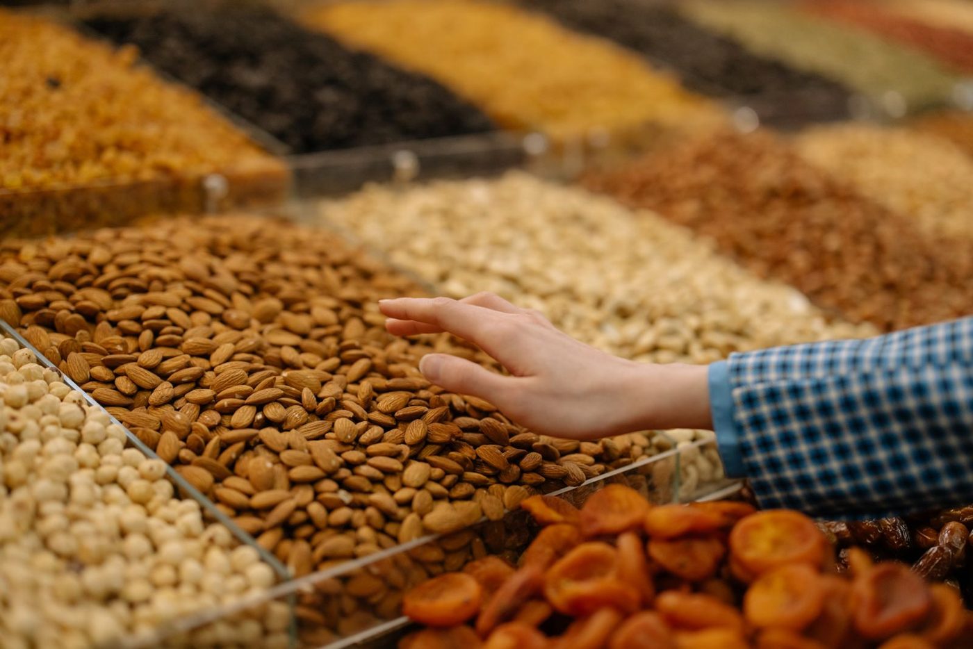 Almonds, dried apricots and nuts on a market display